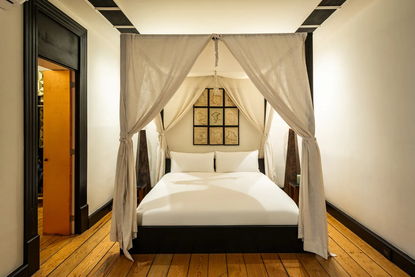 Canopy bed with white drapes — Gravity Suite, La Valise Mexico City