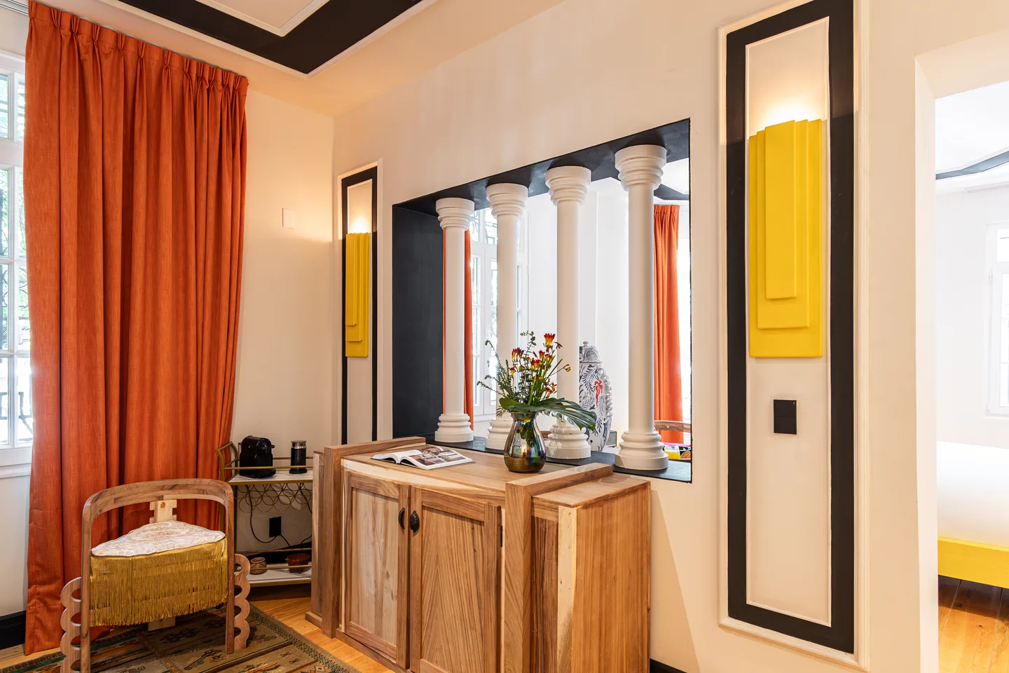 Desk and console before a columned opening — Nebula Suite, La Valise Mexico City