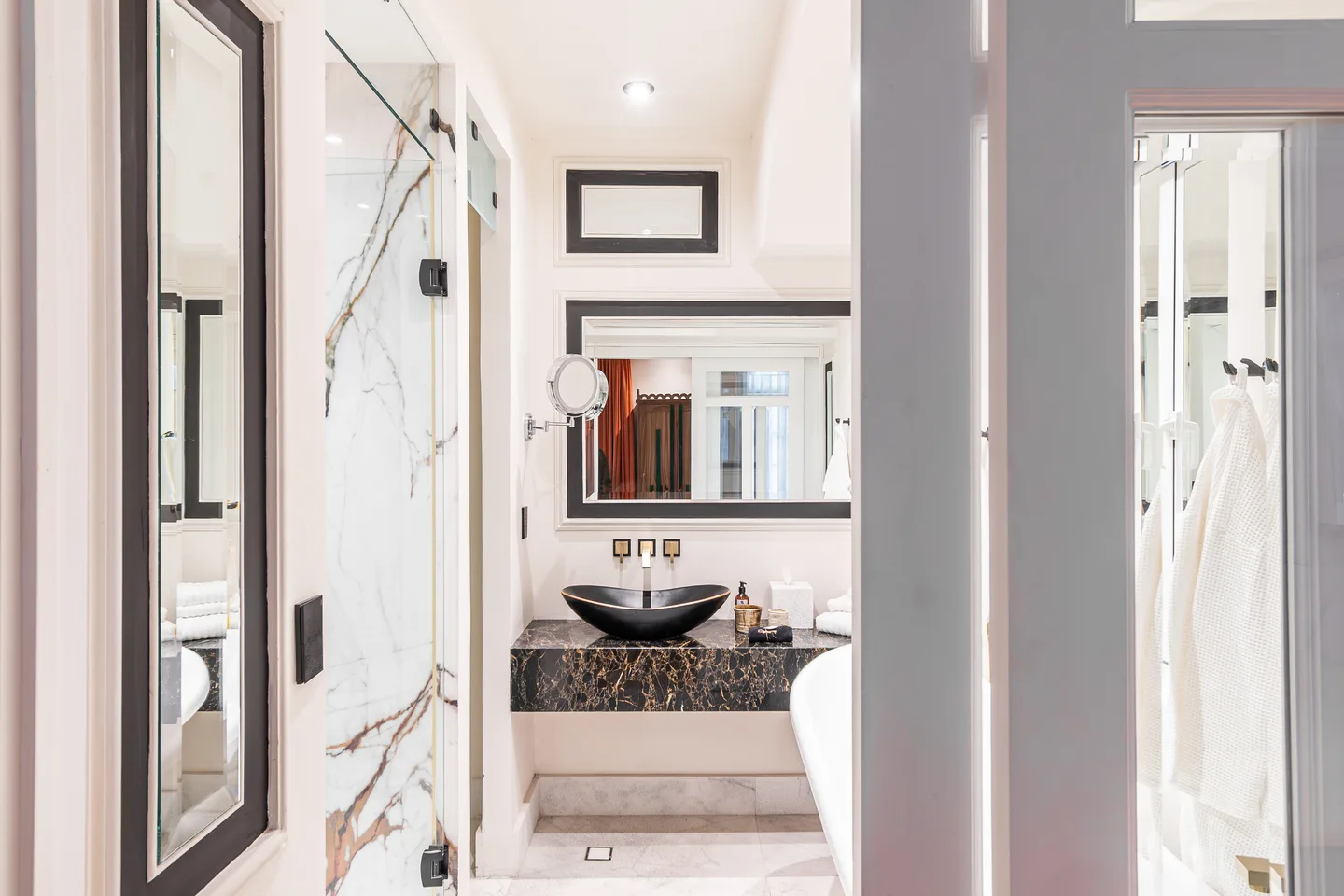 Marble bathroom with vessel basin and mirror — Nova Suite, La Valise Mexico City